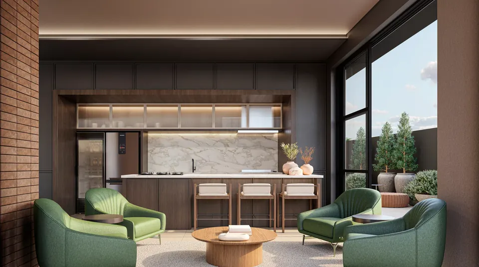 Clubhouse com poltronas verdes e cozinha.